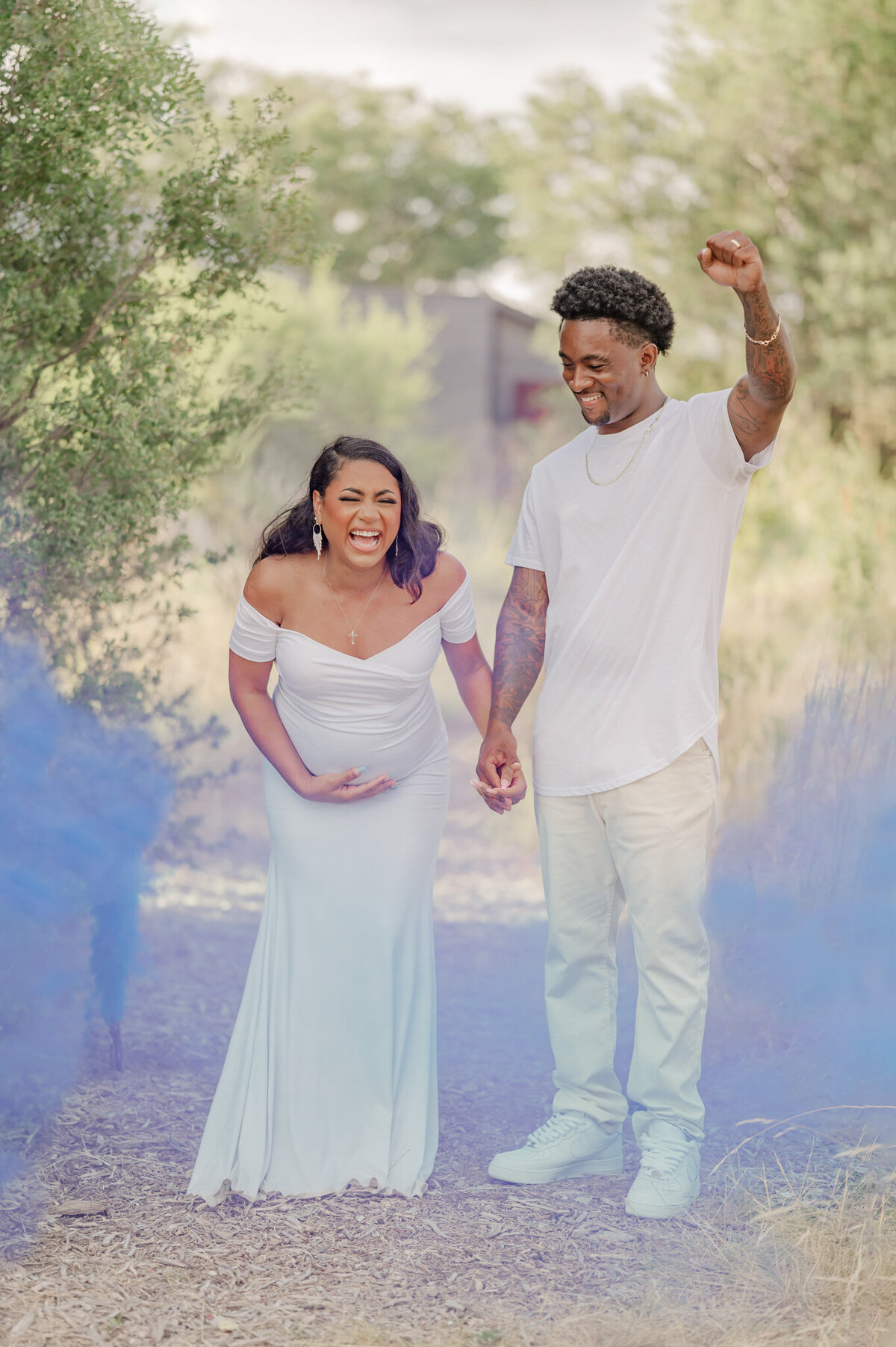 Couple reacting to learning their first baby will be a boy during San Antonio gender reveal pictures with Cassey Golden Photography.