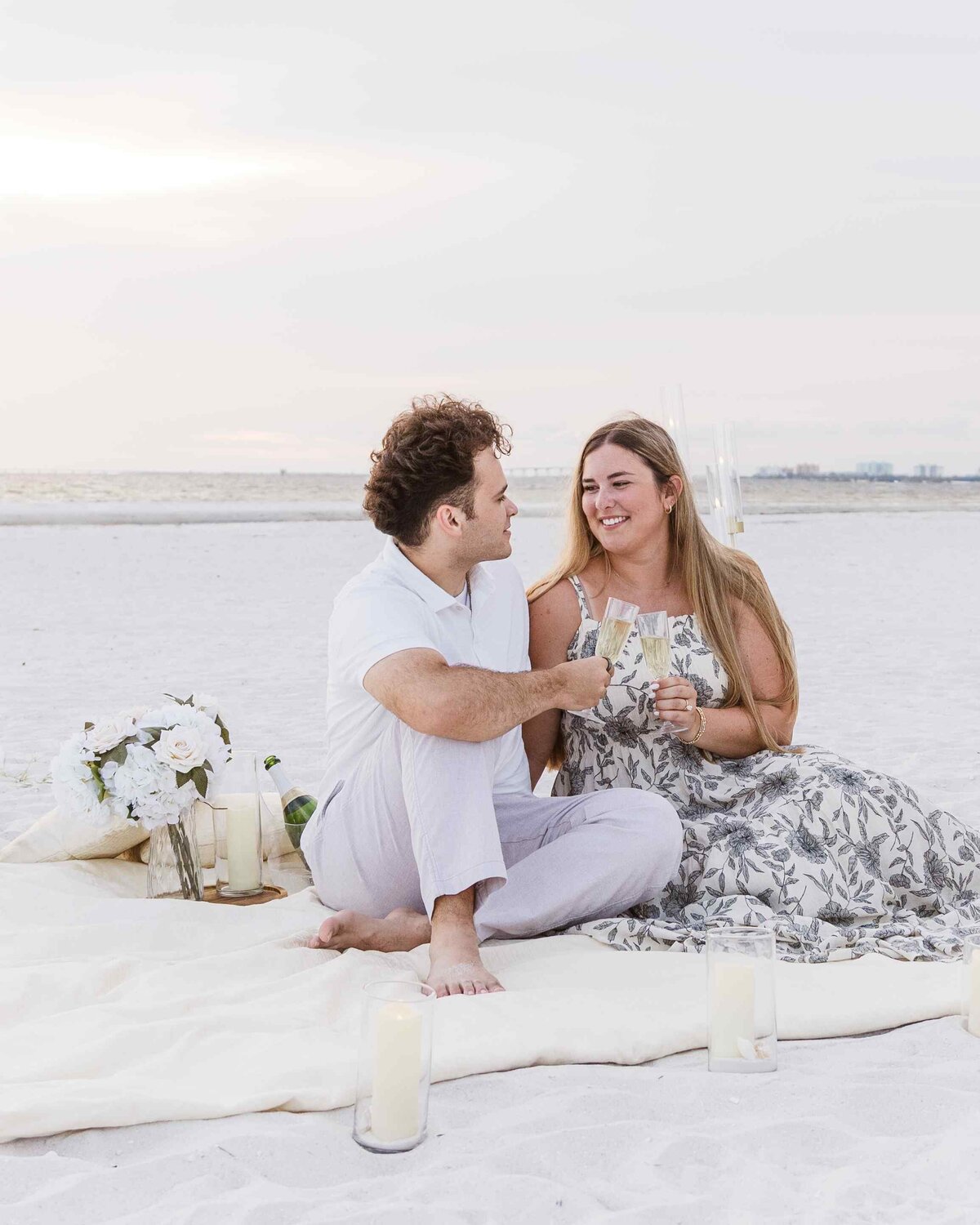 15-couple-toasting-beach-picnic