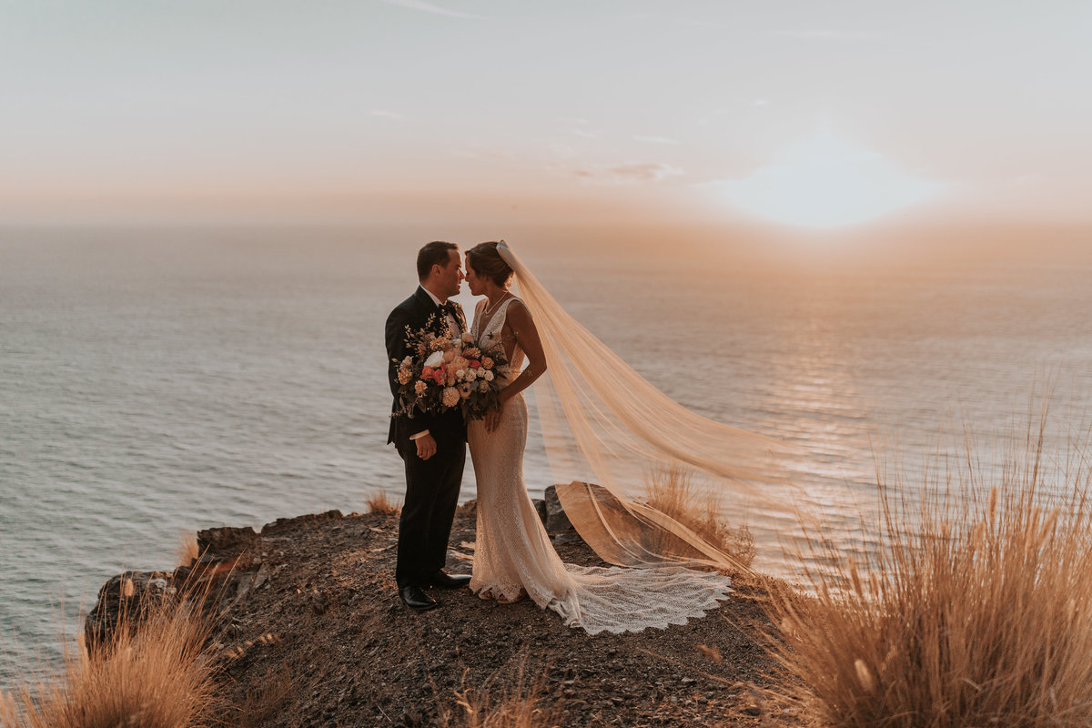 Cliffside couple at sunset newlywed elopement