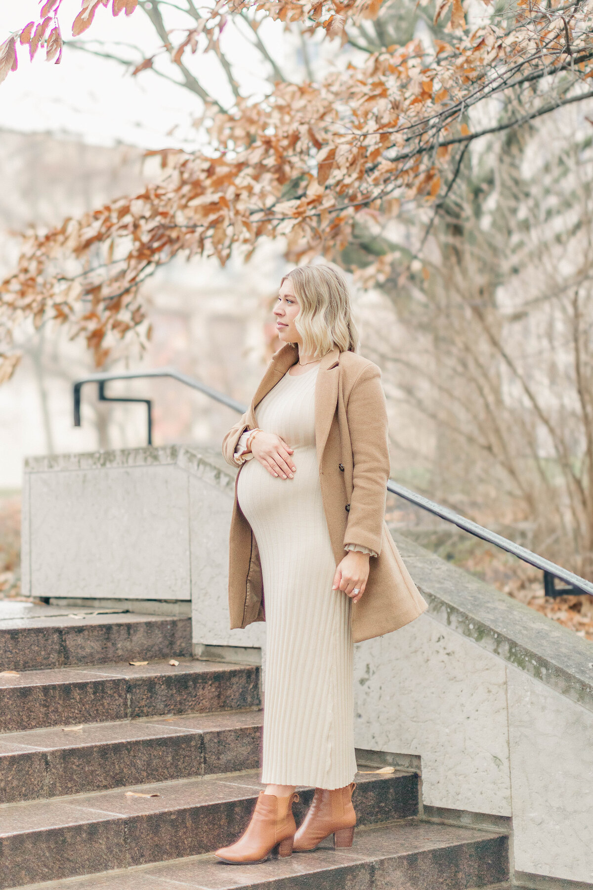 Maternity portrait of a mother-to-be cradling her bump at the Nelson in Kansas City 