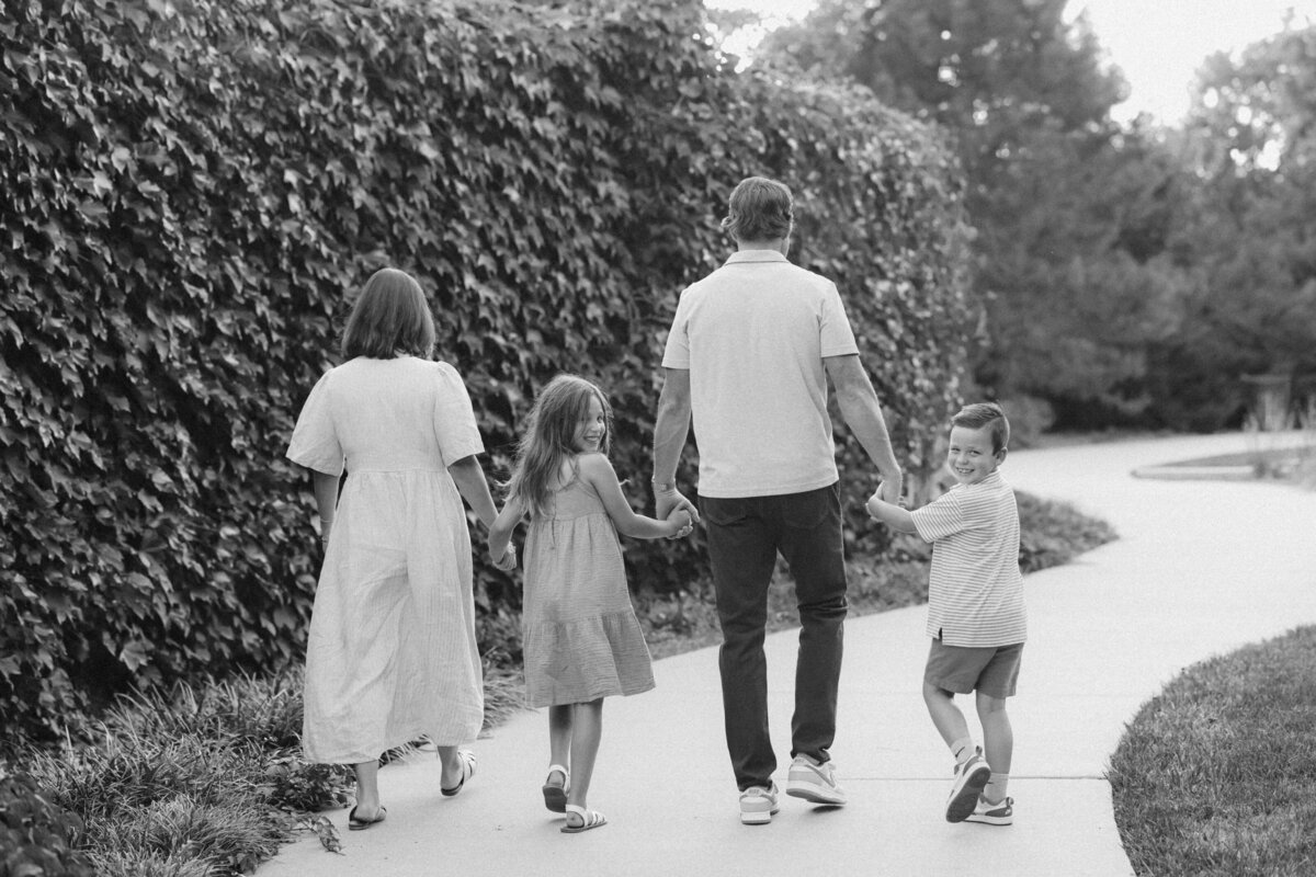 black and white editorial family walking