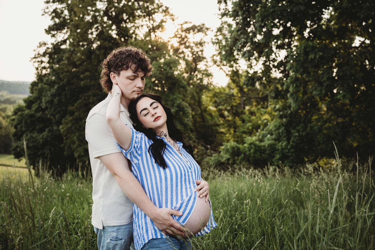 husband and wife embracing each other in portrait session with reva davis photography
