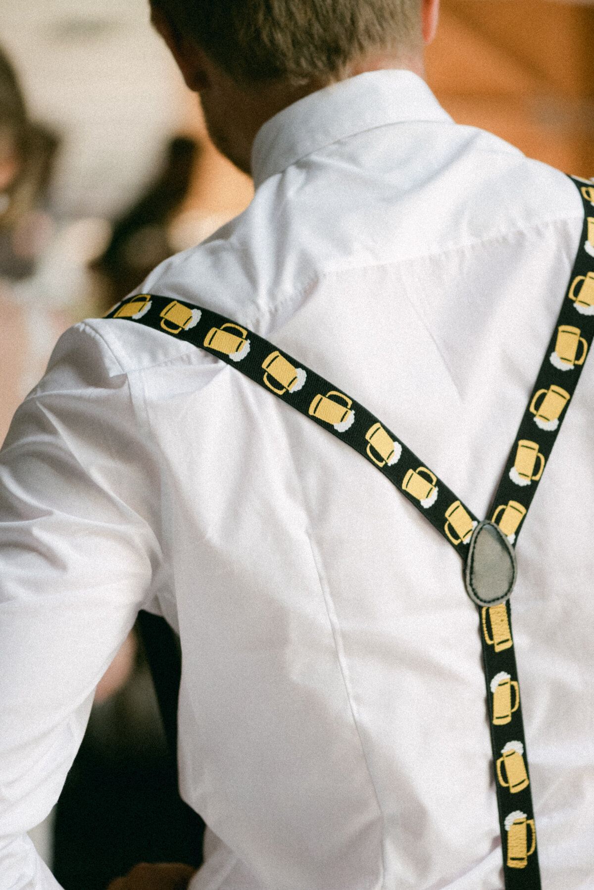 Funny suspenders in an image captured by wedding photographer Hannika Gabrielsson.