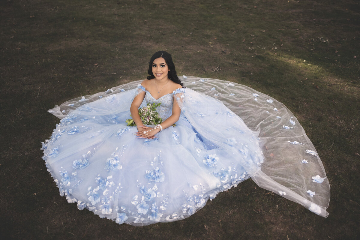 Victoria posing in her quinceañera gown at University Circle, Cleveland, combining urban beauty with her graceful presence.