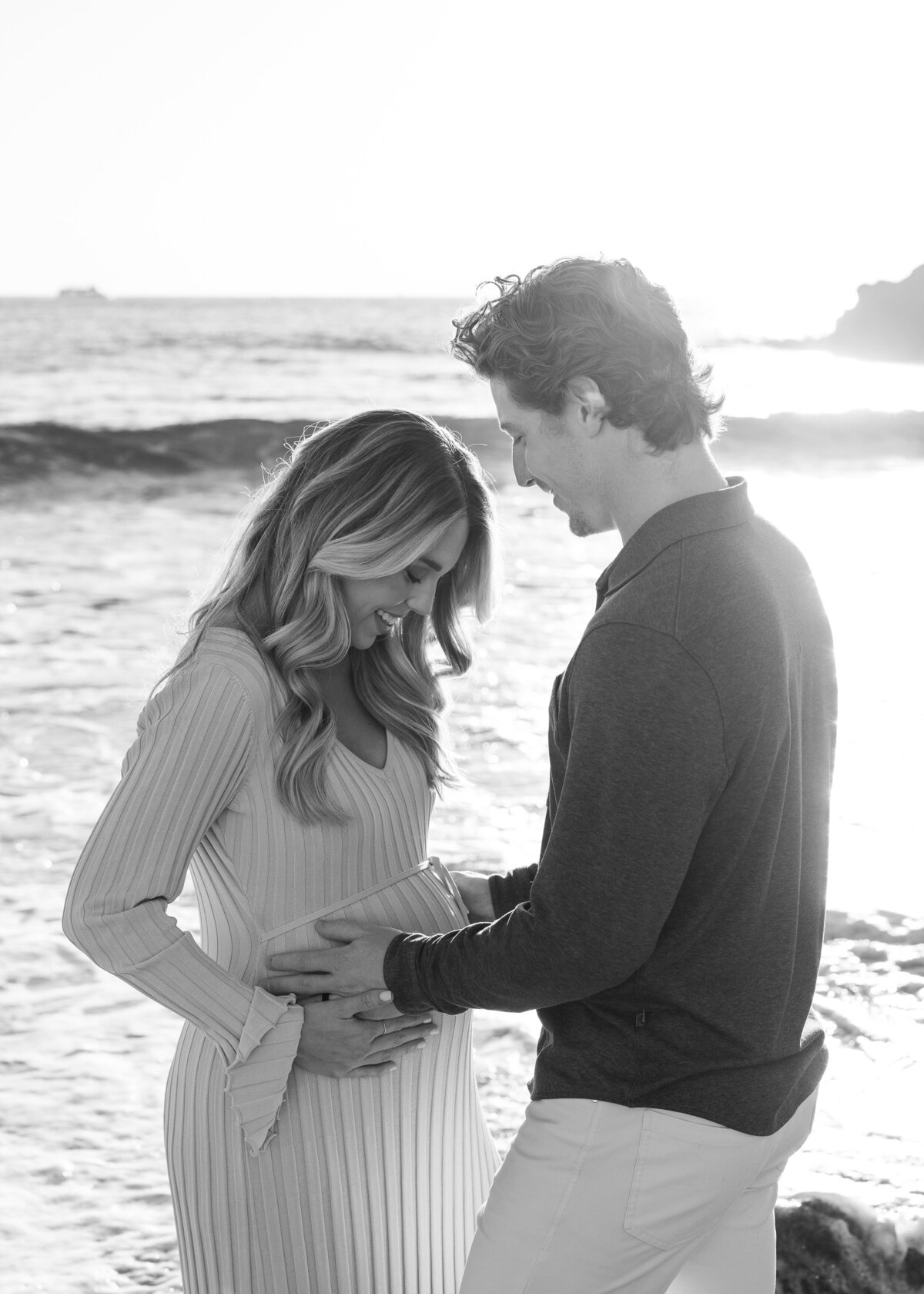 sweet and candid maternity photo on the beach