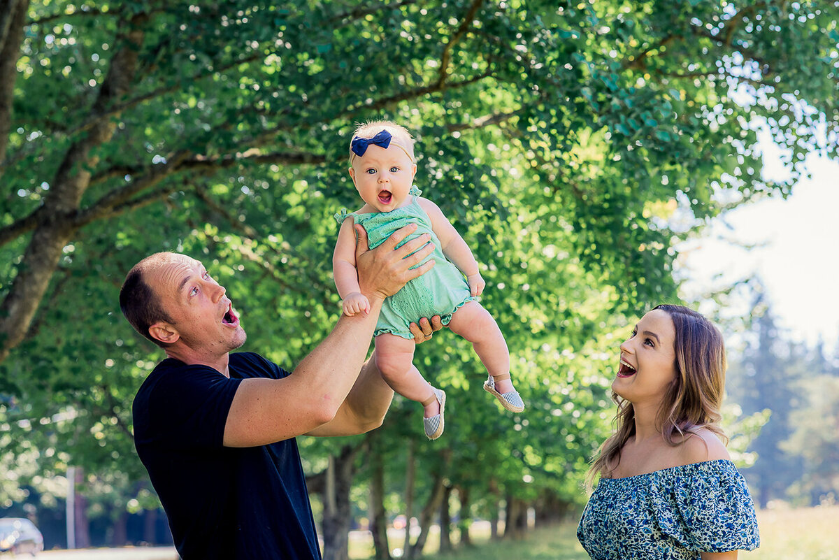 family raising up baby girl