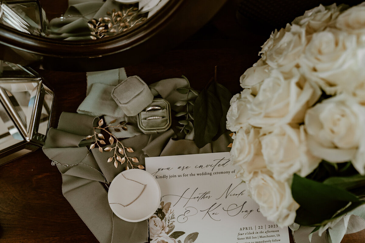 wedding-detail-flatlay-green-and-white-sister-hill-manchester-iowa-storyteller-collective-photo-co