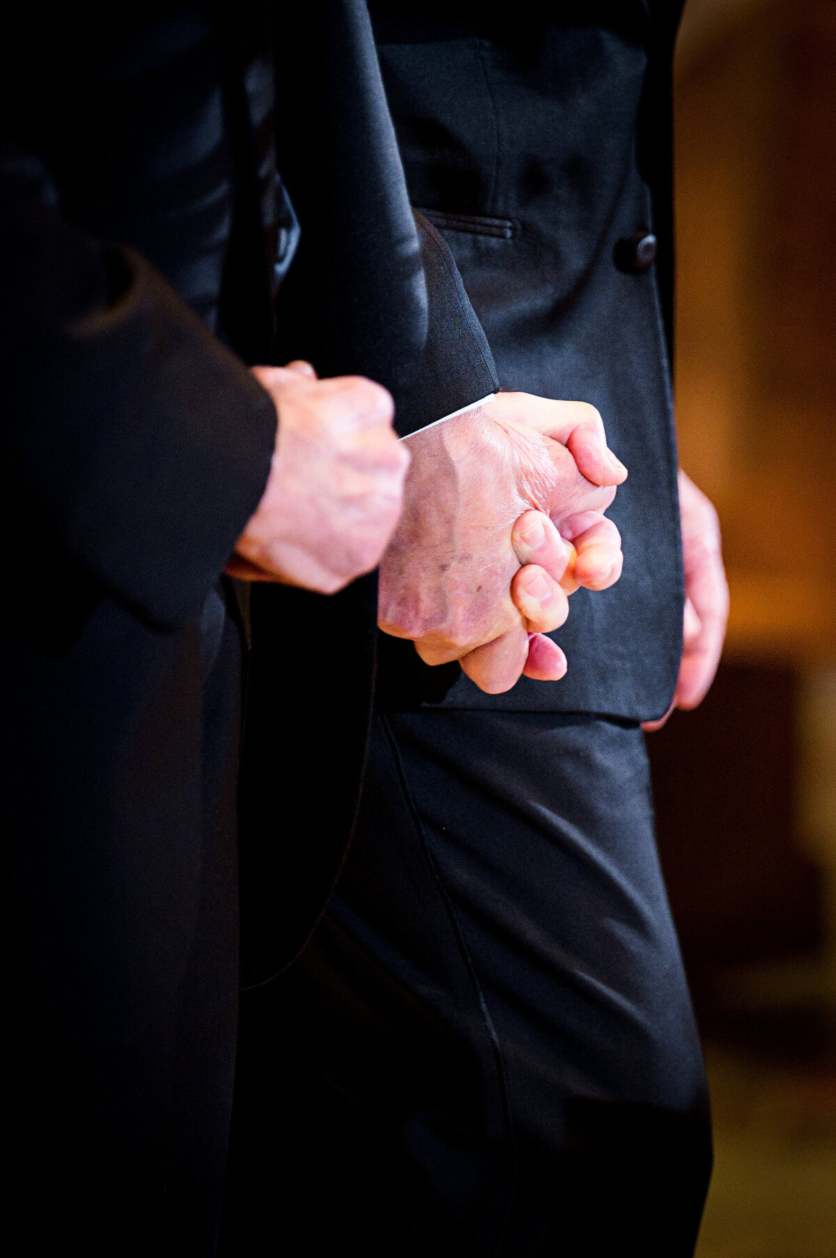 groom holding hand with best man in anticipation of wedding day