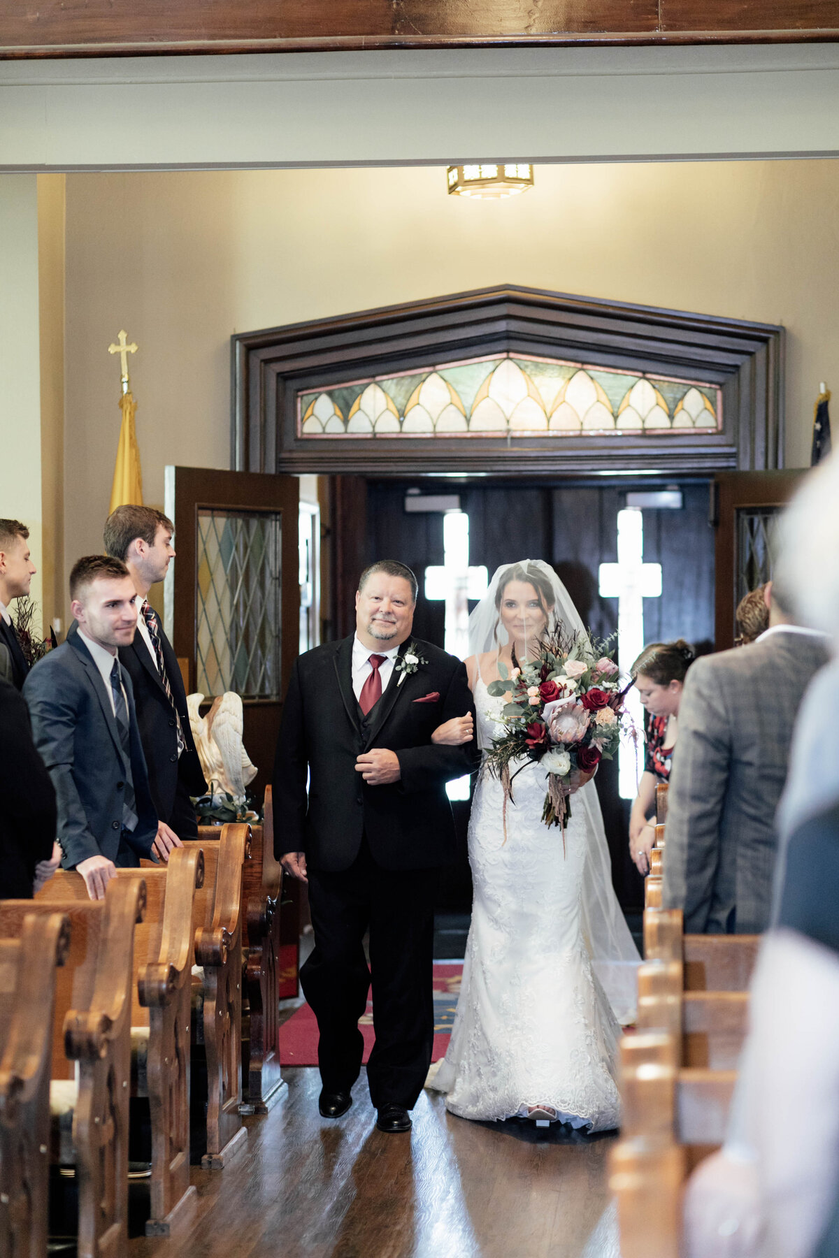 Bride walking down the aisle with her dad. 