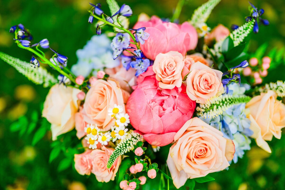 colorful wedding bouquet sitting on grass at Van Dickson Ranch Skull Valley