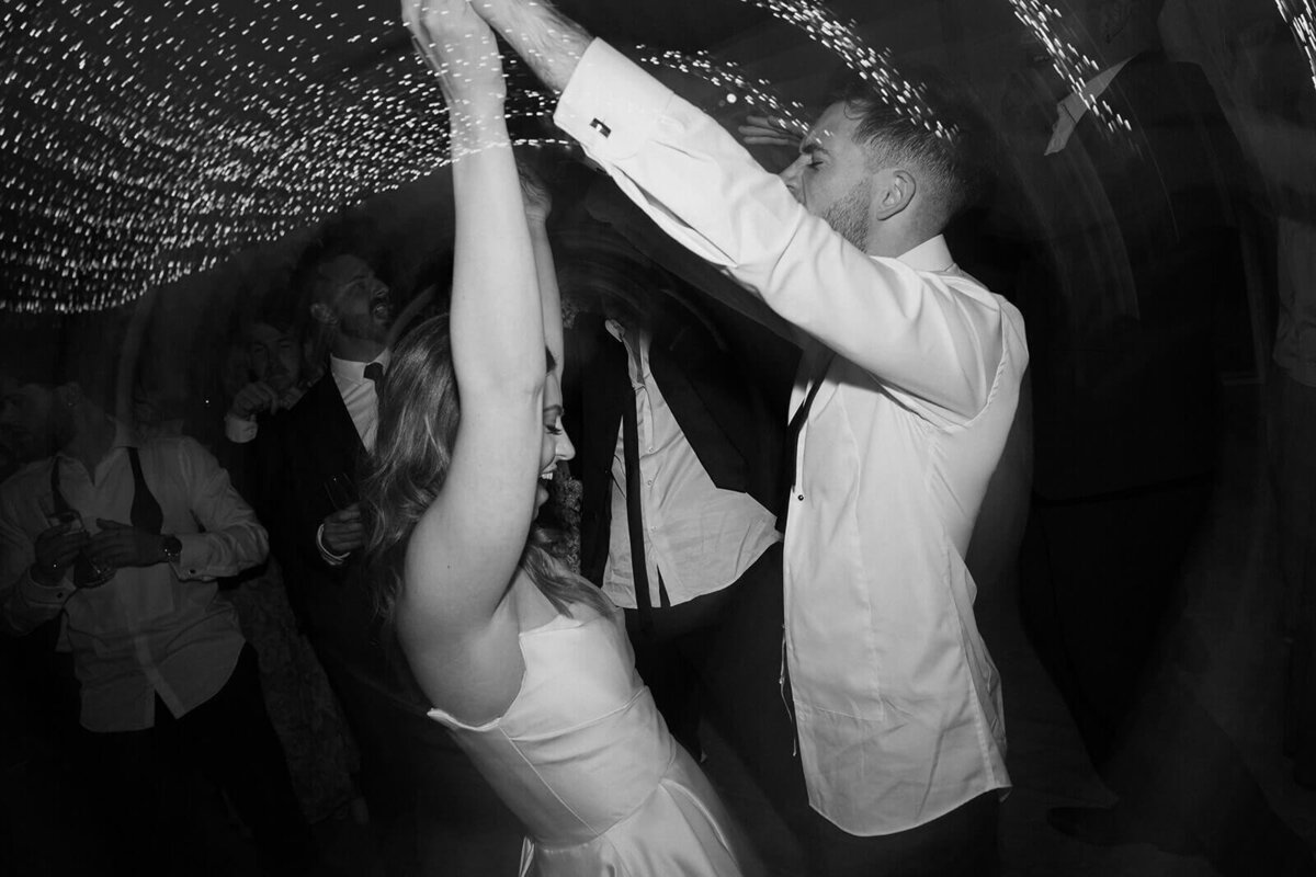 bride and groom on the dance floor during their wedding 