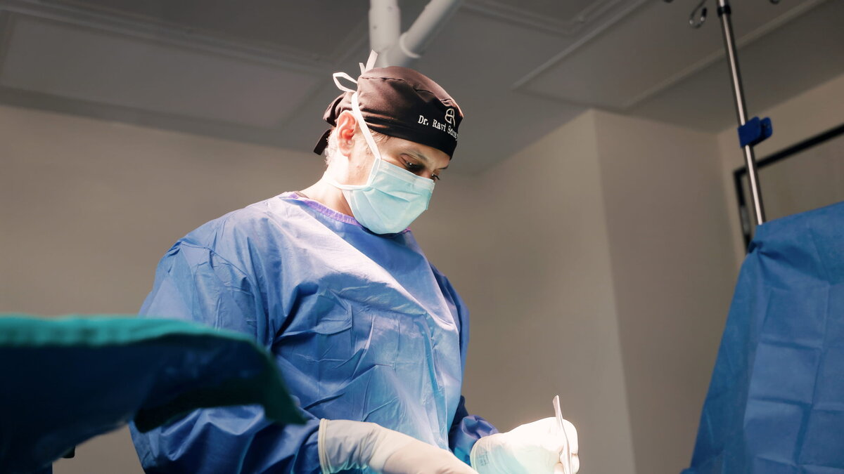 Plastic surgeon operating, filmed by Luma Media