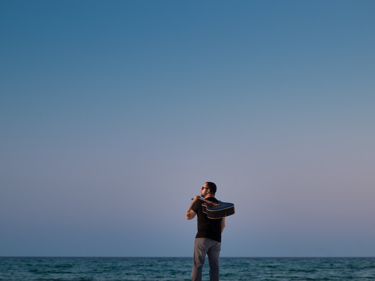 A man looking out to the ocean