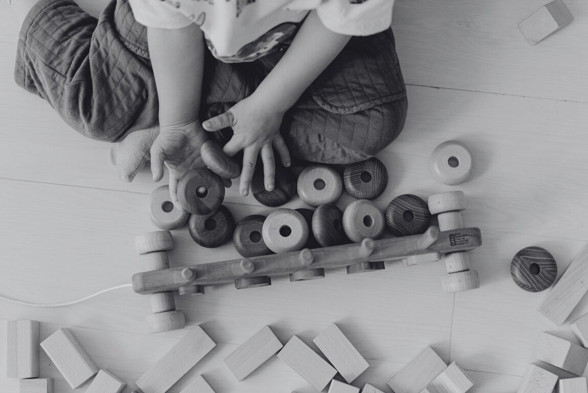BW_Child Playing with Wooden Toys
