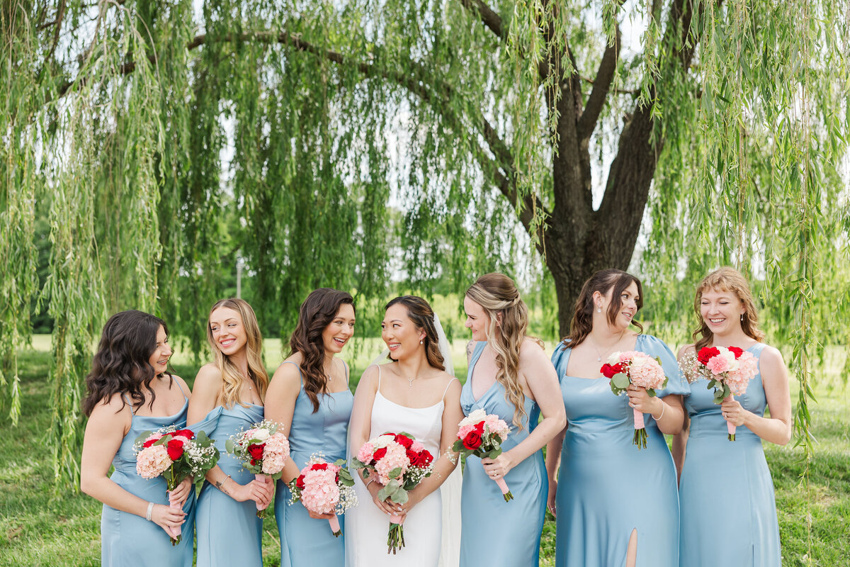 bridesmaids under the willow tree at the osprey's at belmont bay in virginia