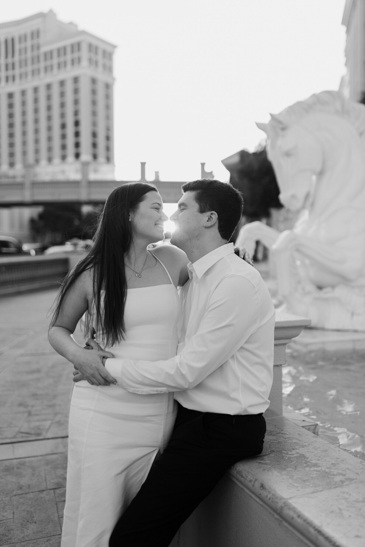 A couple leans in to each other on The Strip.