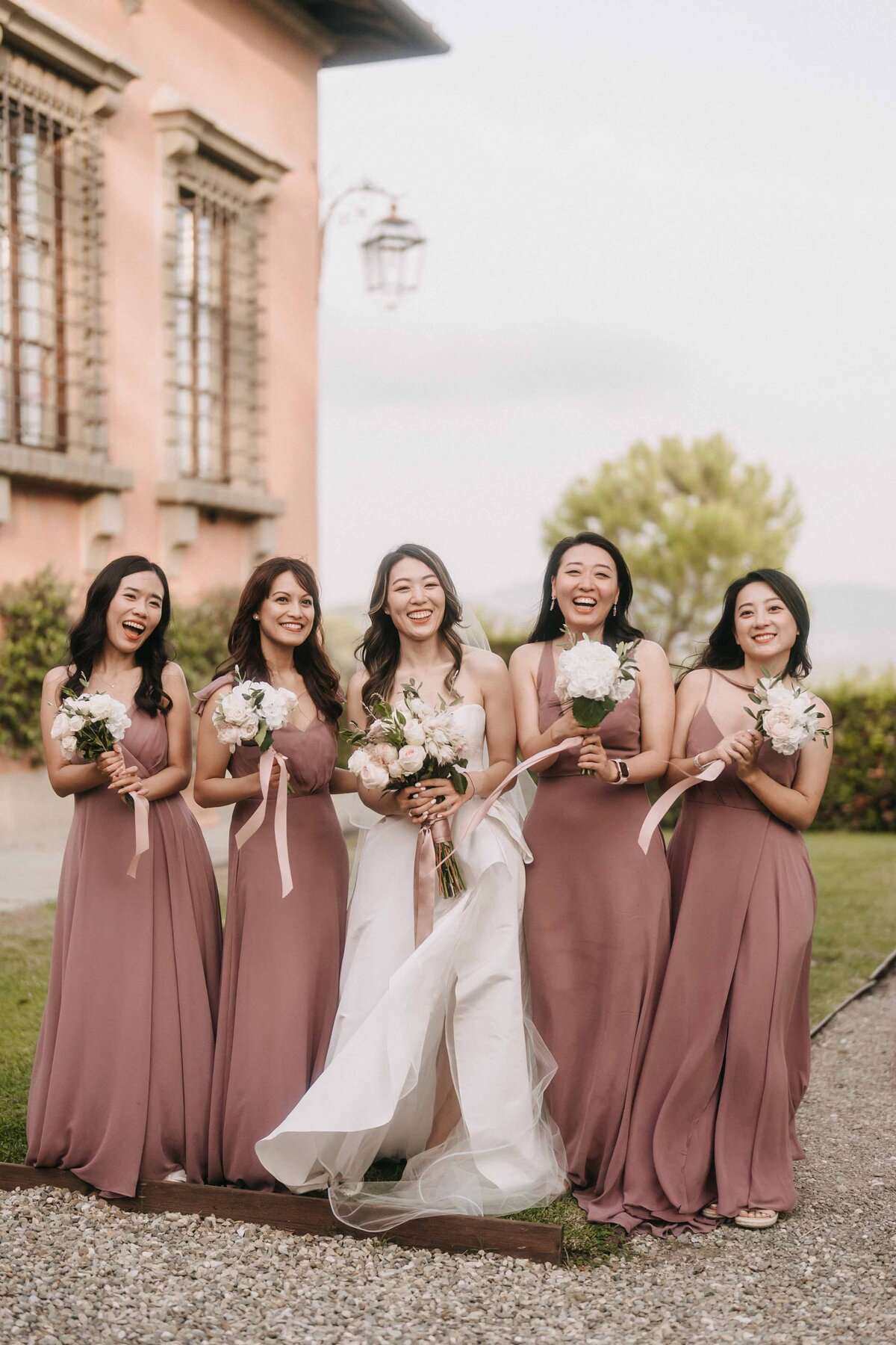 bride and the bridesmaid group photo at villa mangiacane