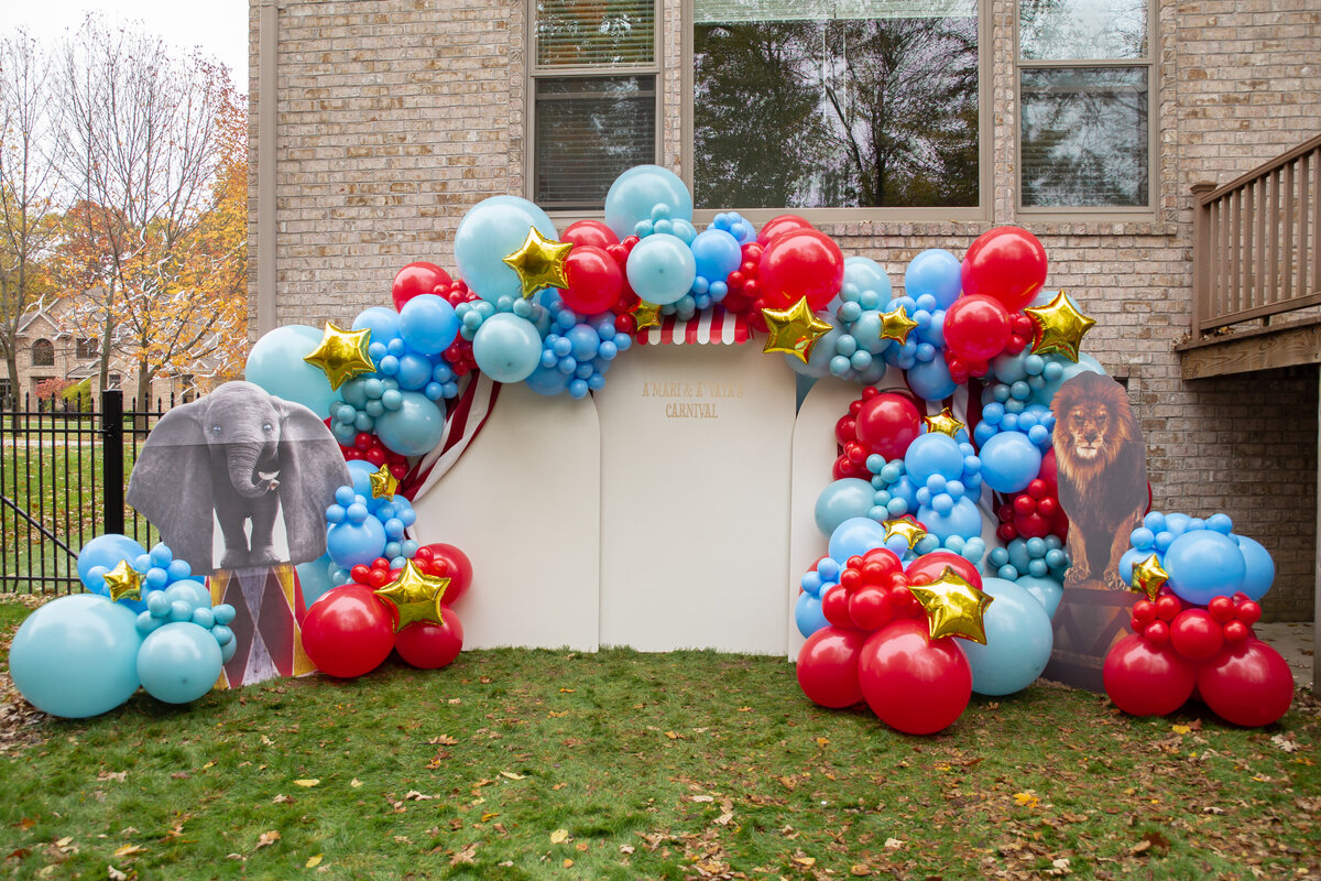 Red, blue, and gold balloons with circus animals