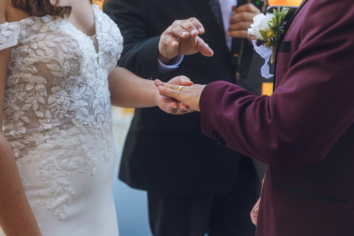 Close-up of the bride and groom exchanging rings during the ceremony.