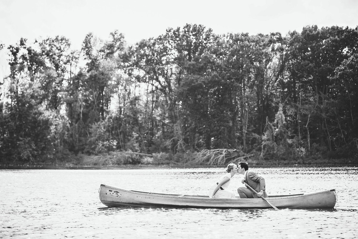 Bride and groom taking a canoe ride