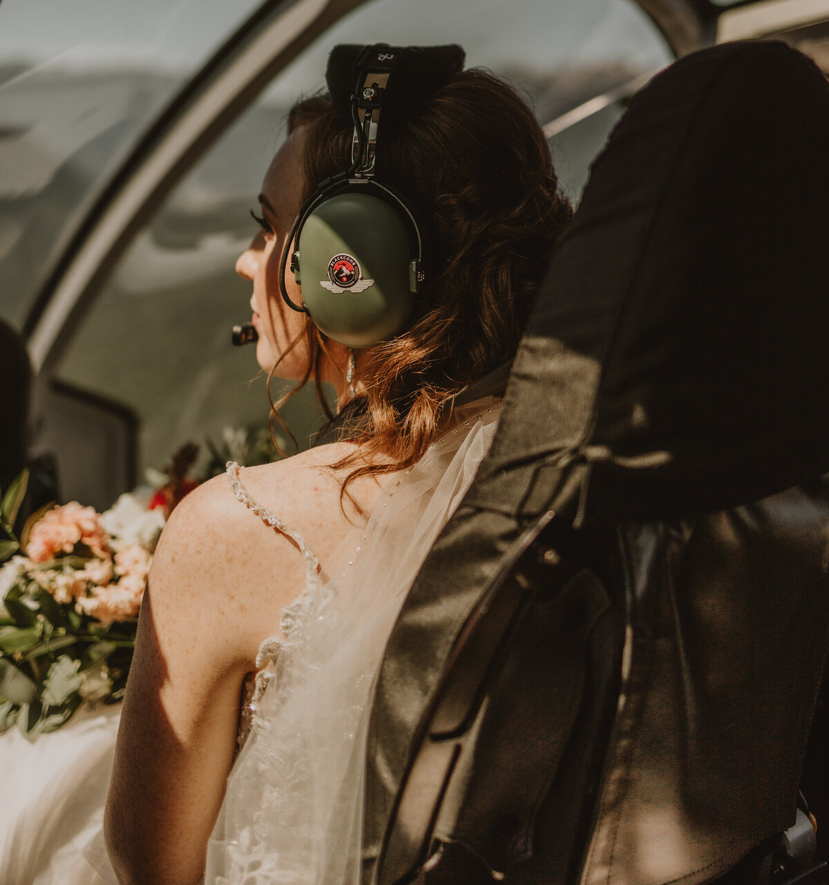 Bride looking outside in helicopter