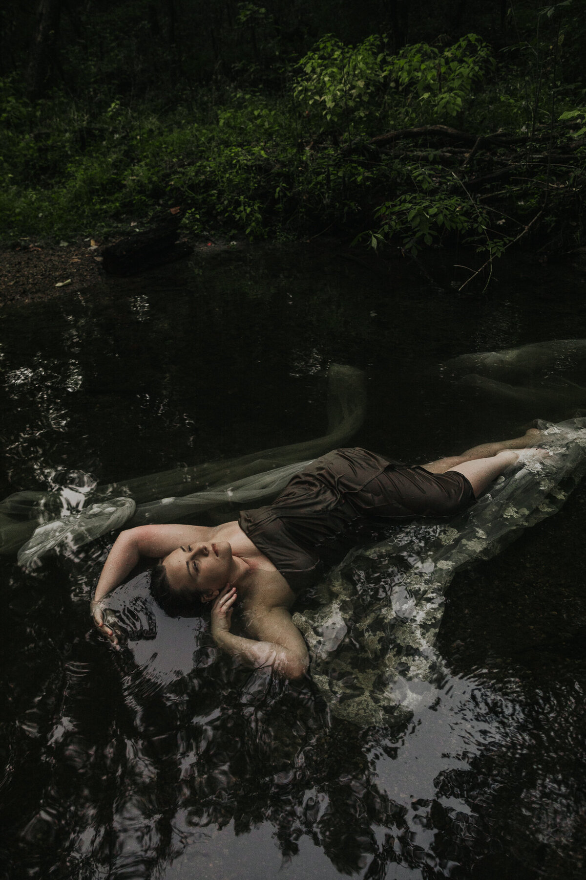 Laying in the dark creek