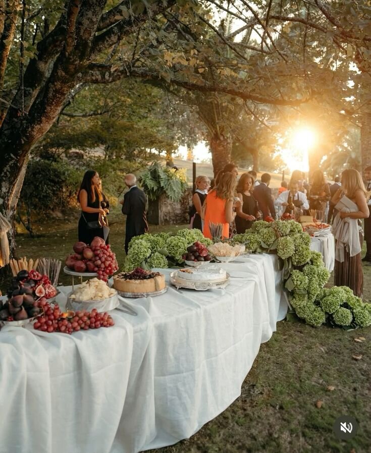 Sunset cocktail hour with grazing table and lush greenery, a look we’d style for a Wrightsville Manor wedding in Wilmington NC
