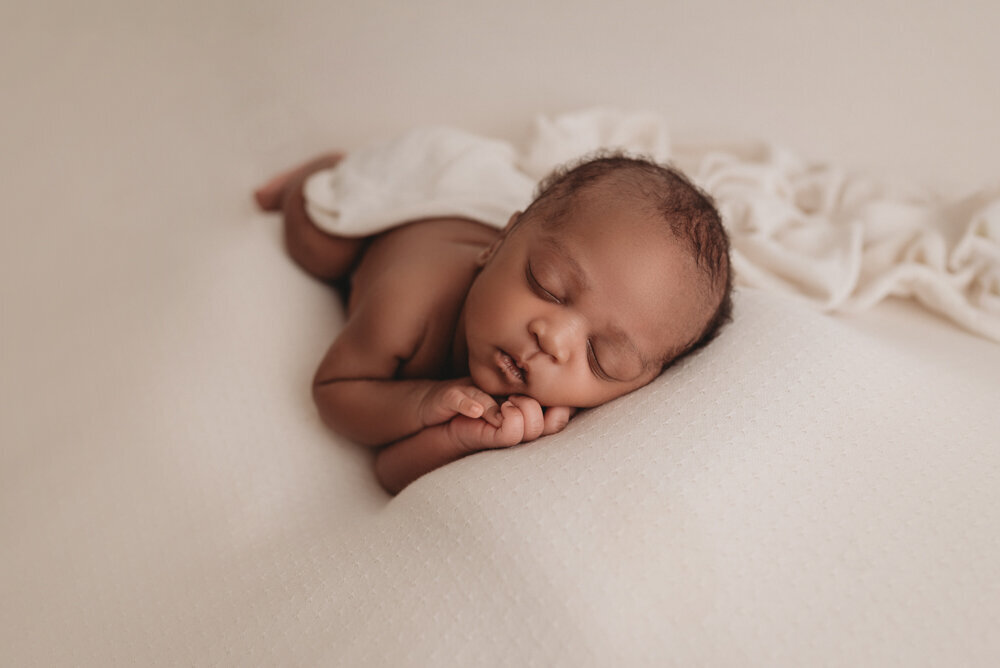 Newborn photos with Atlanta, Georgia newborn photographer of sleeping baby boy with hands under chin