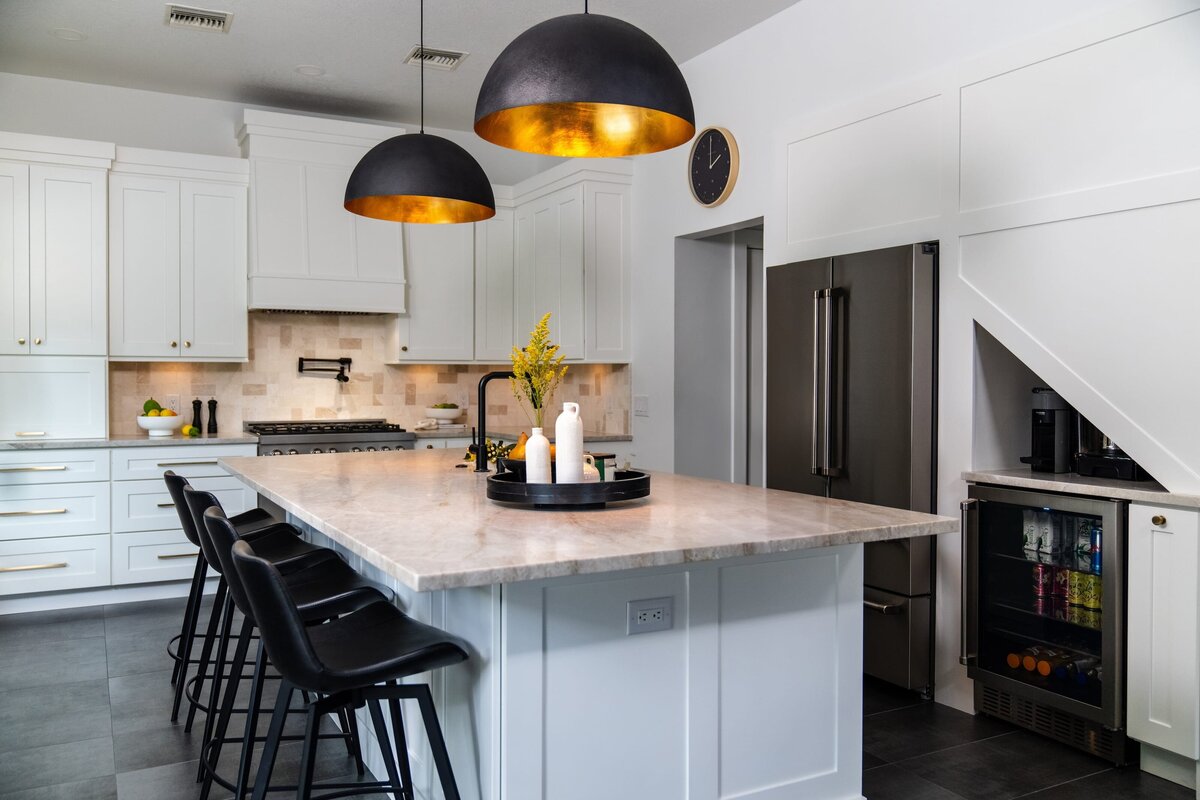 dewine design interiors farmhouse modern kitchen with black barstools and large black pendent lighting over island