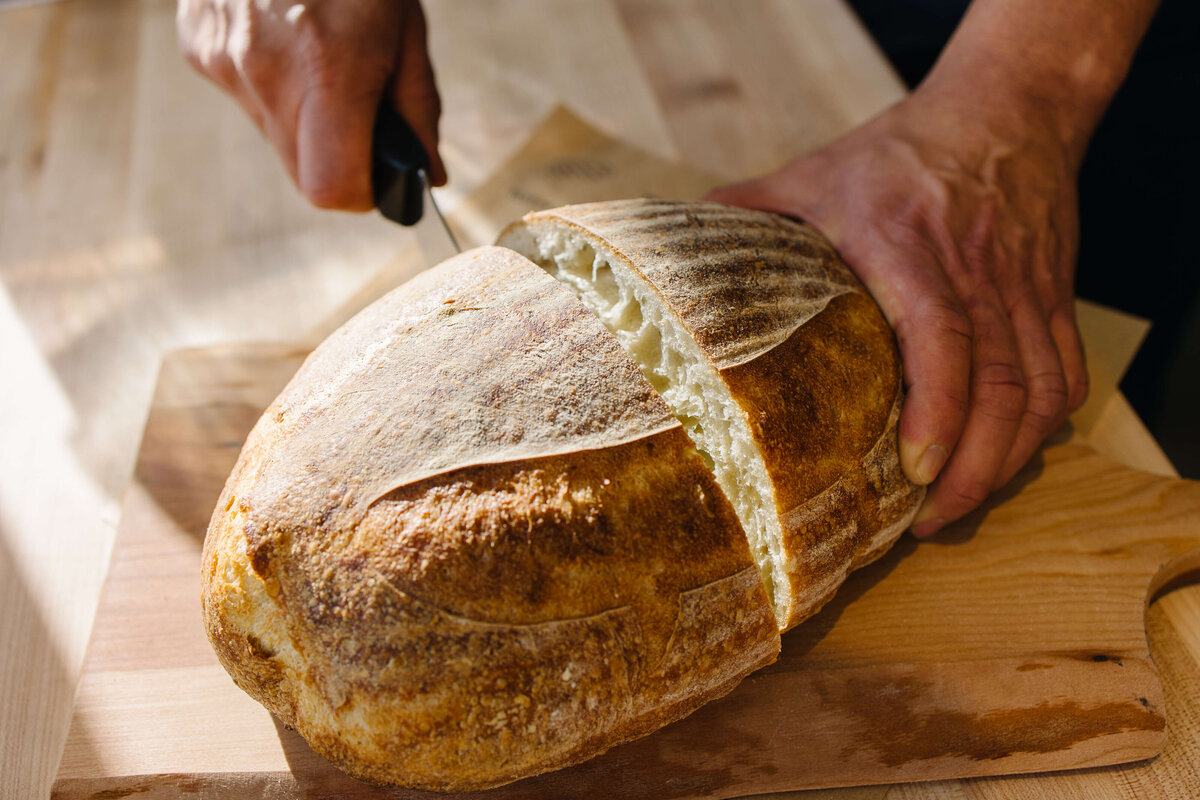 Bread-being-sliced-bakery-photo-by-southern-idaho-commercial-brand-photographer-erin-moore