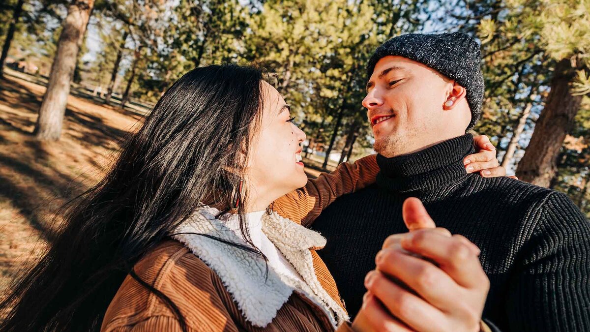 Engaged-couple-dancing-forest