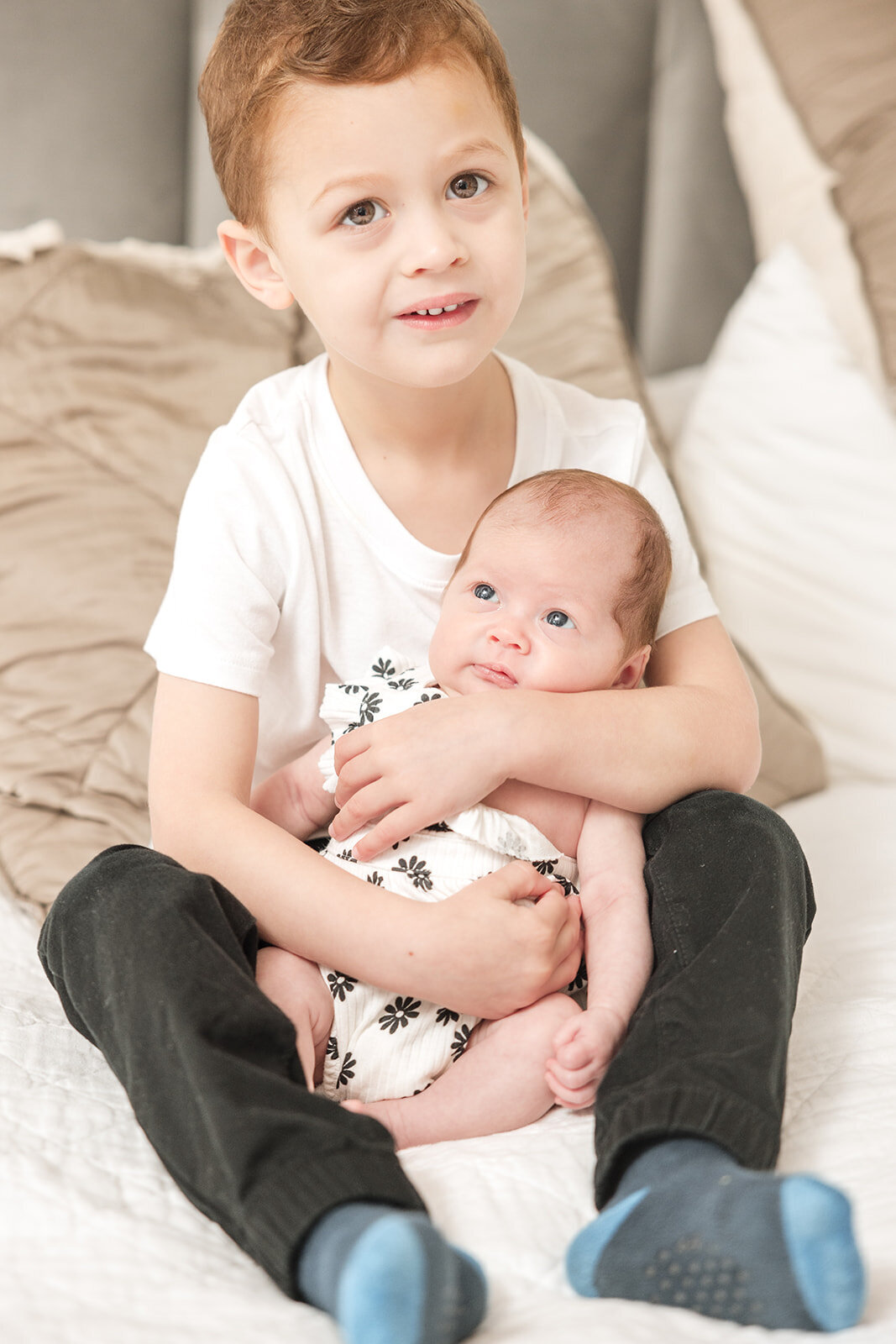 Father snuggling baby girl during relaxed in-home photo shoot in Orlando

