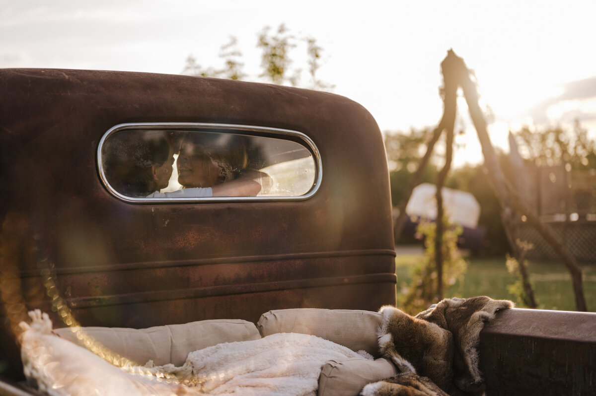 couple kissing in  their truck