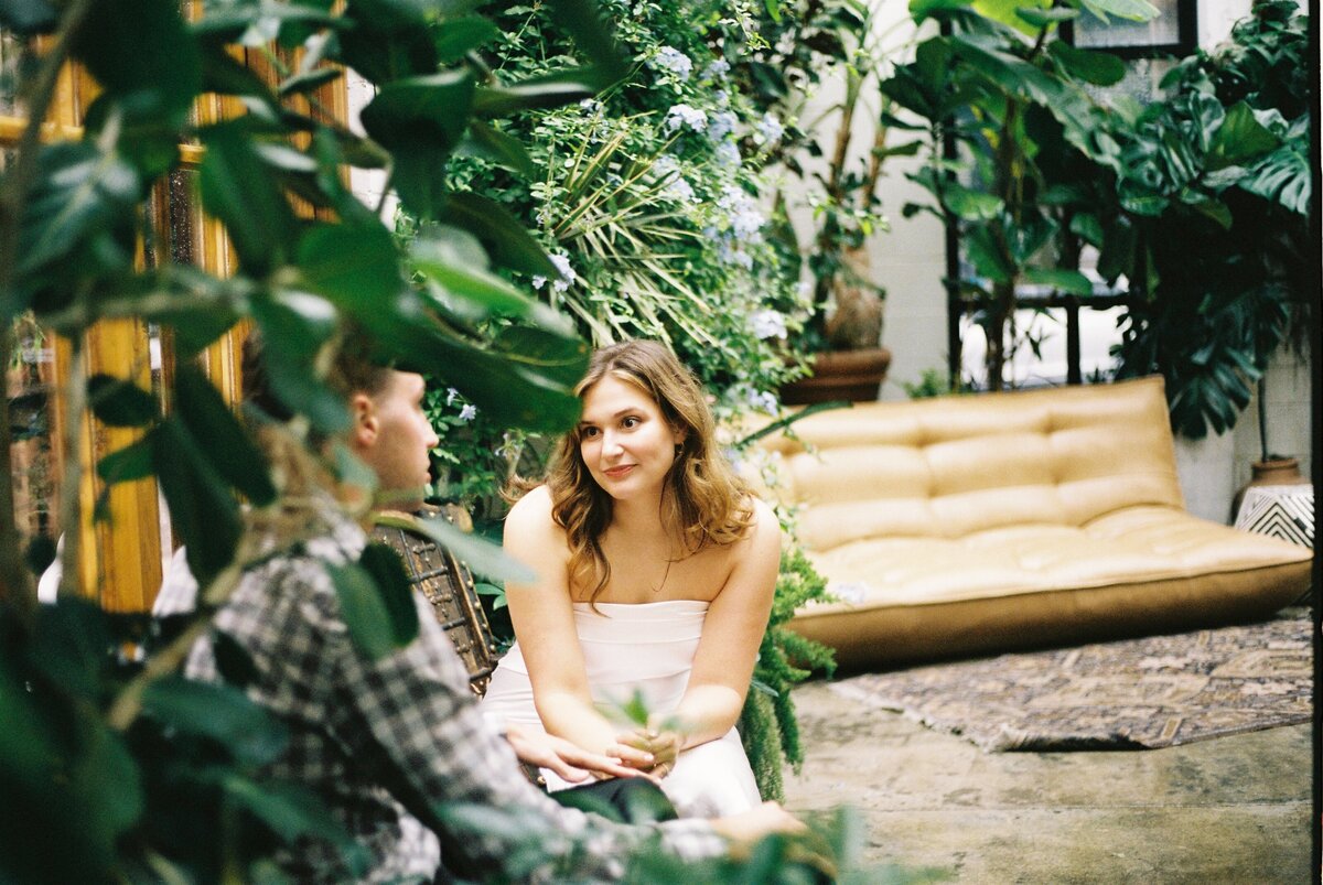 couple sitting together in outdoor courtyard