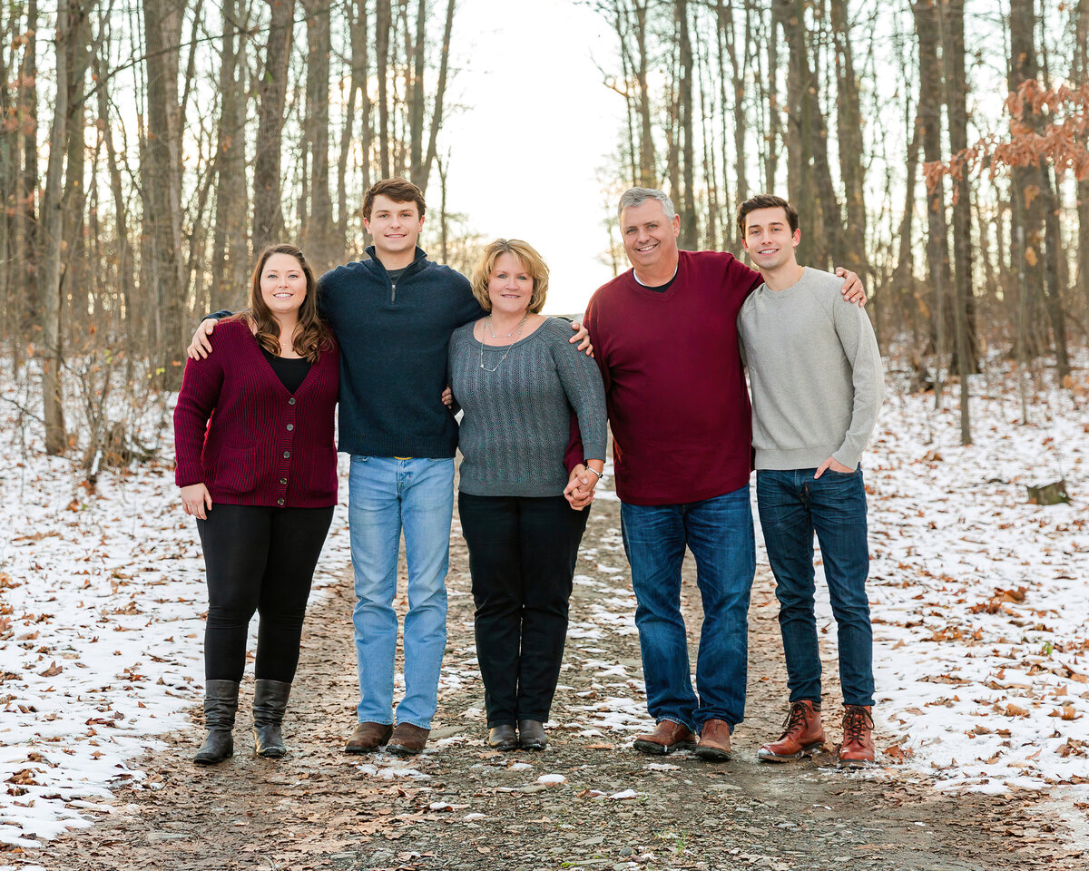 Winter family portrait wearing burgundy gray and blue jeans outdoors in Penn Yan, NY