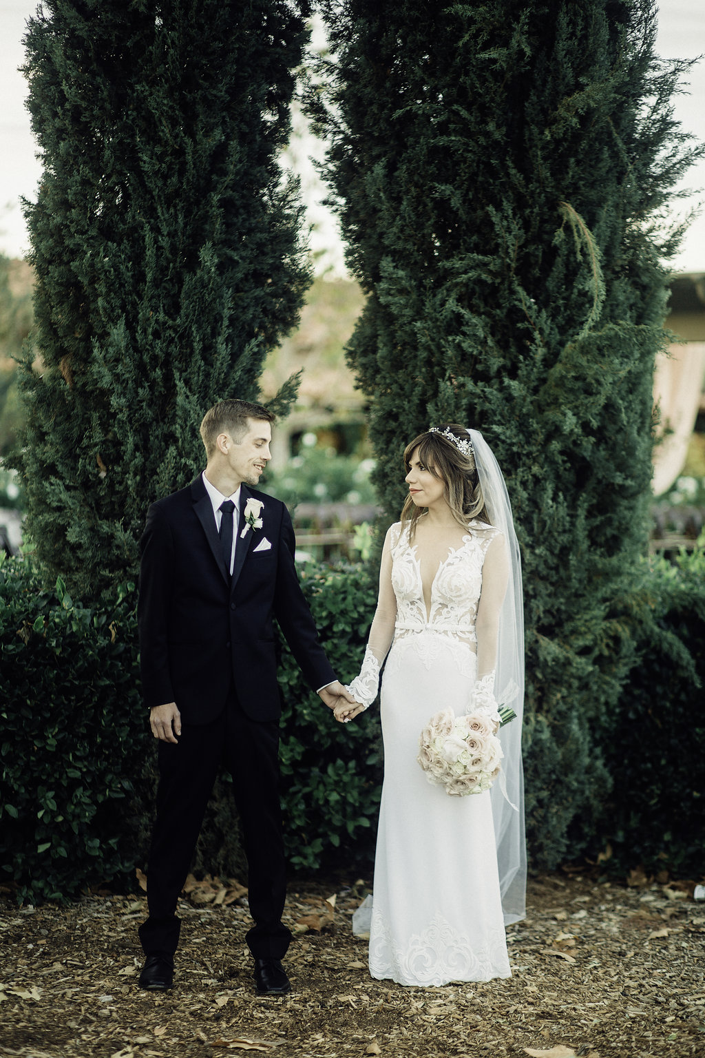 Wedding Photograph Of Bride And Groom Staring At Each Other In The Garden Los Angeles