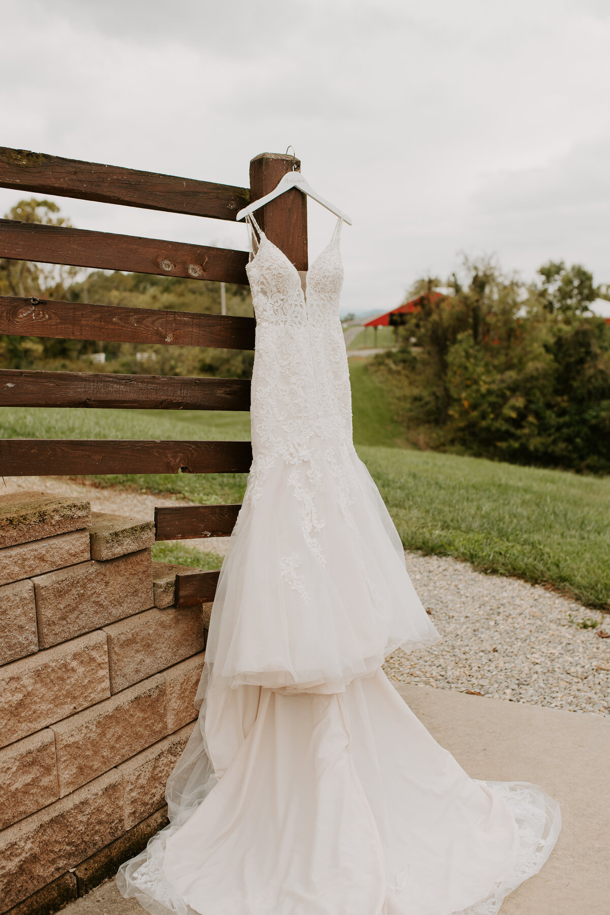Wedding dress inspiration in a rustic barn backdrop. Miss Stella York gown #6793