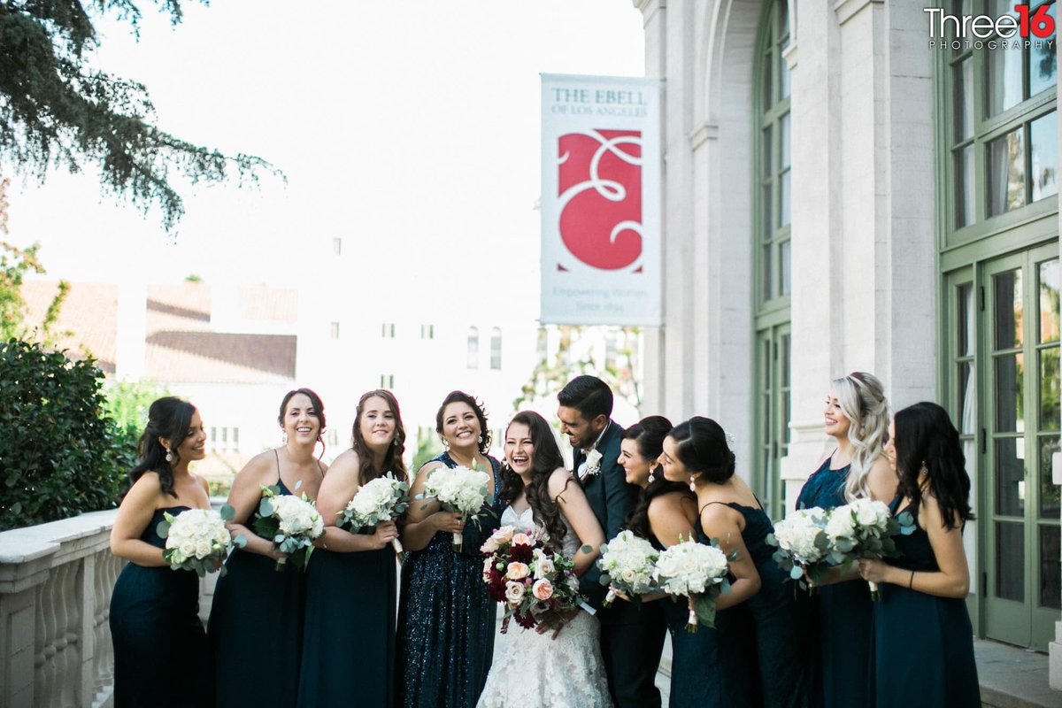 Bride and Groom share a laugh with the Bridesmaids