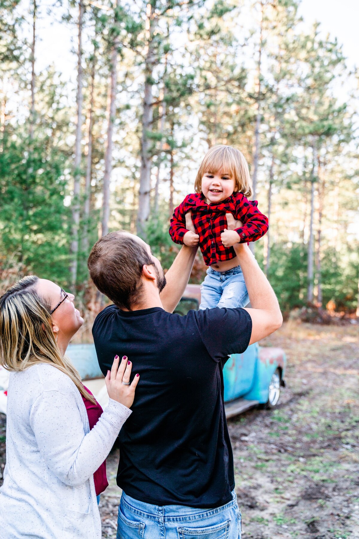 Parents holding toddler