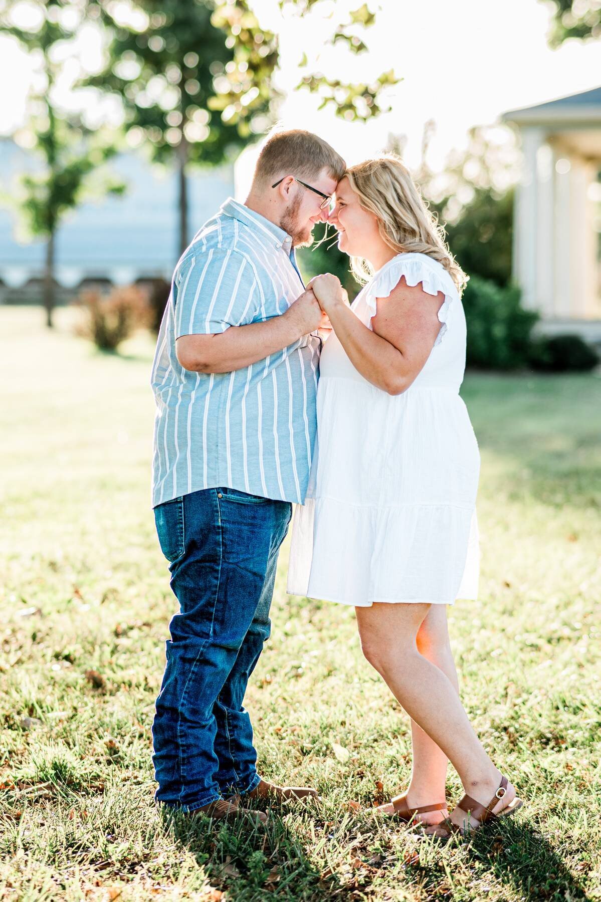 A couple holding hands standing