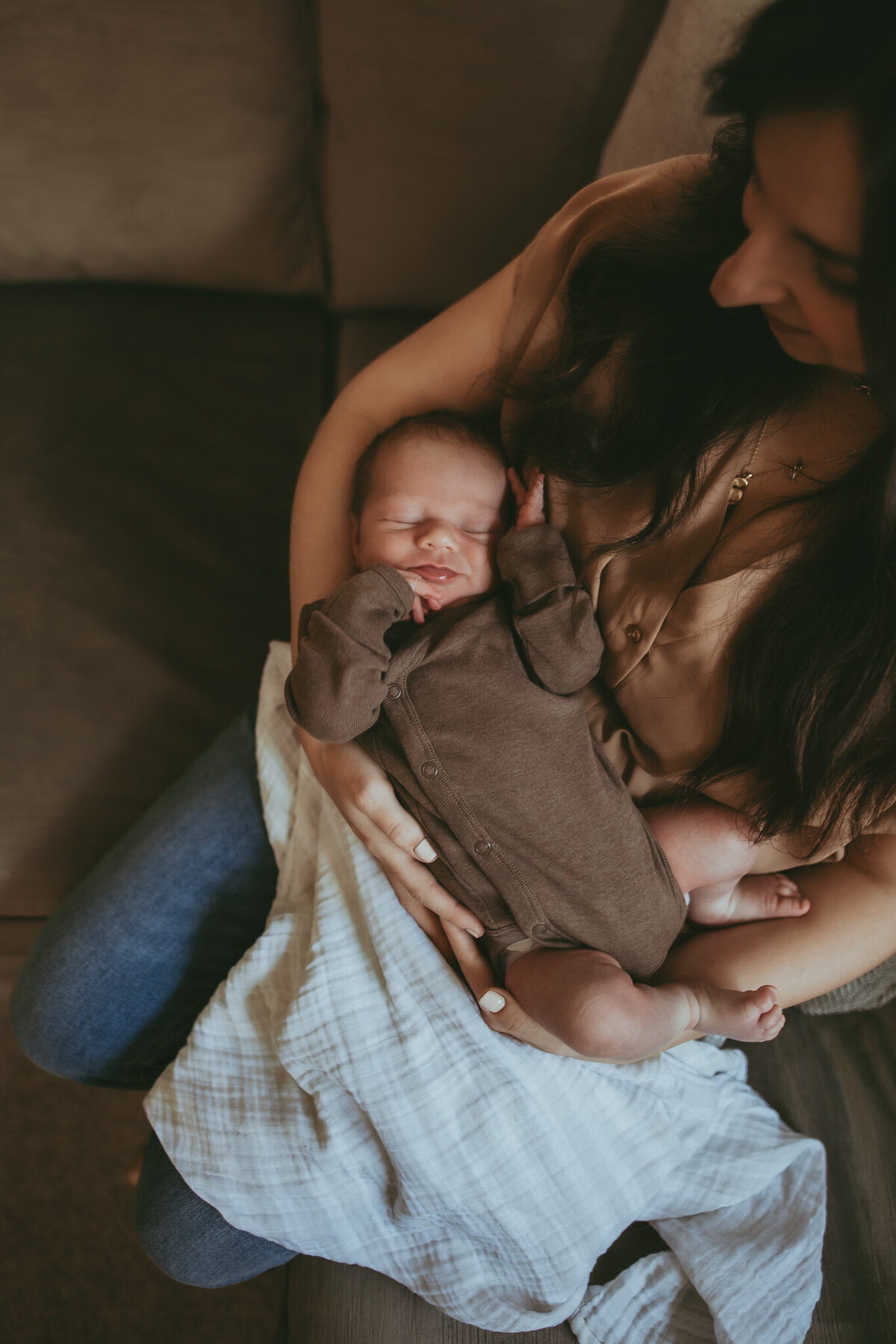 newborn photos baby snuggled with mom