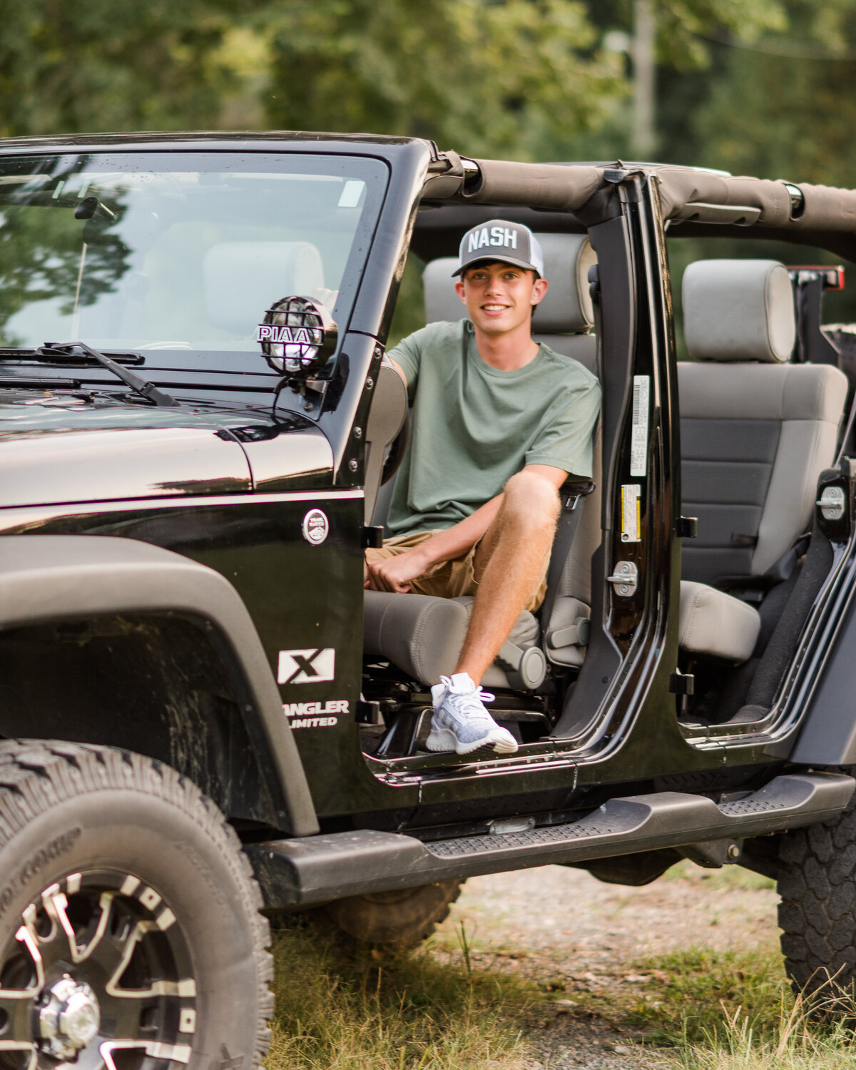 black jeep wrangler senior in field no doors-8820