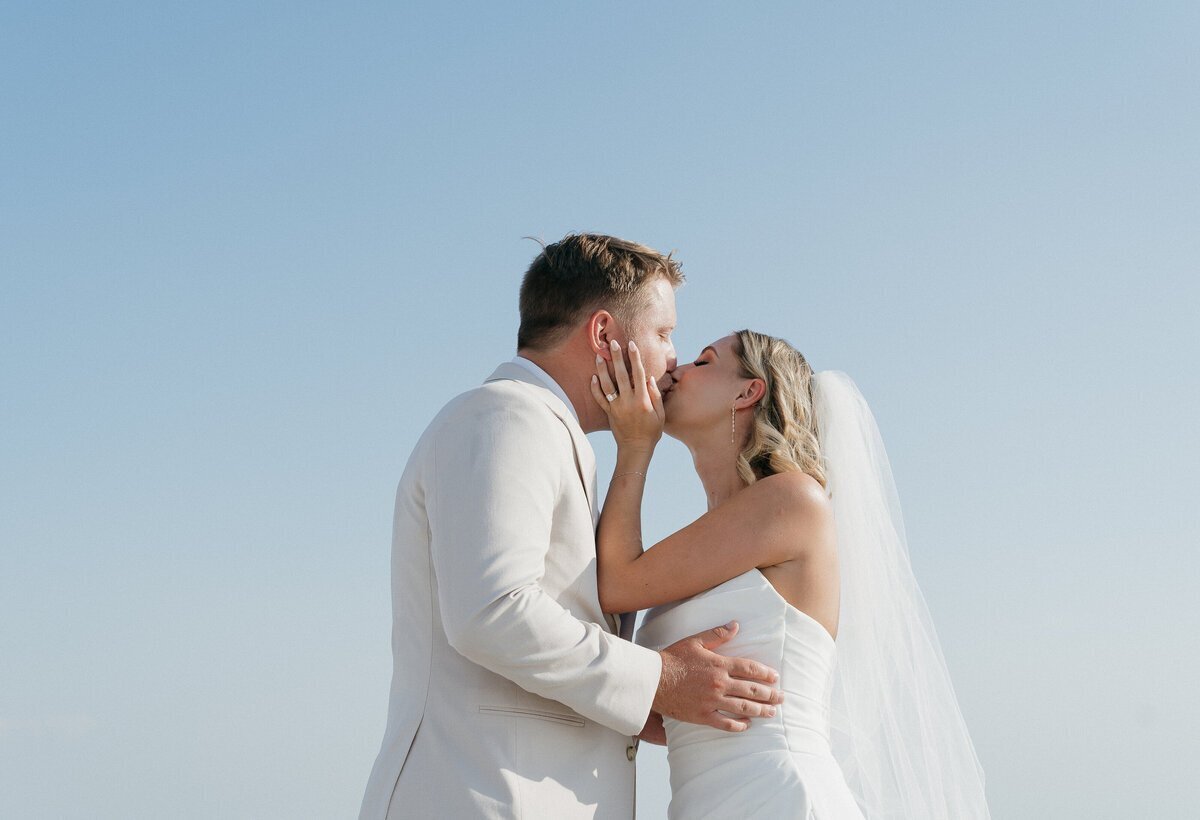Bride and groom kissing by Shelby Ann, film wedding photographer
