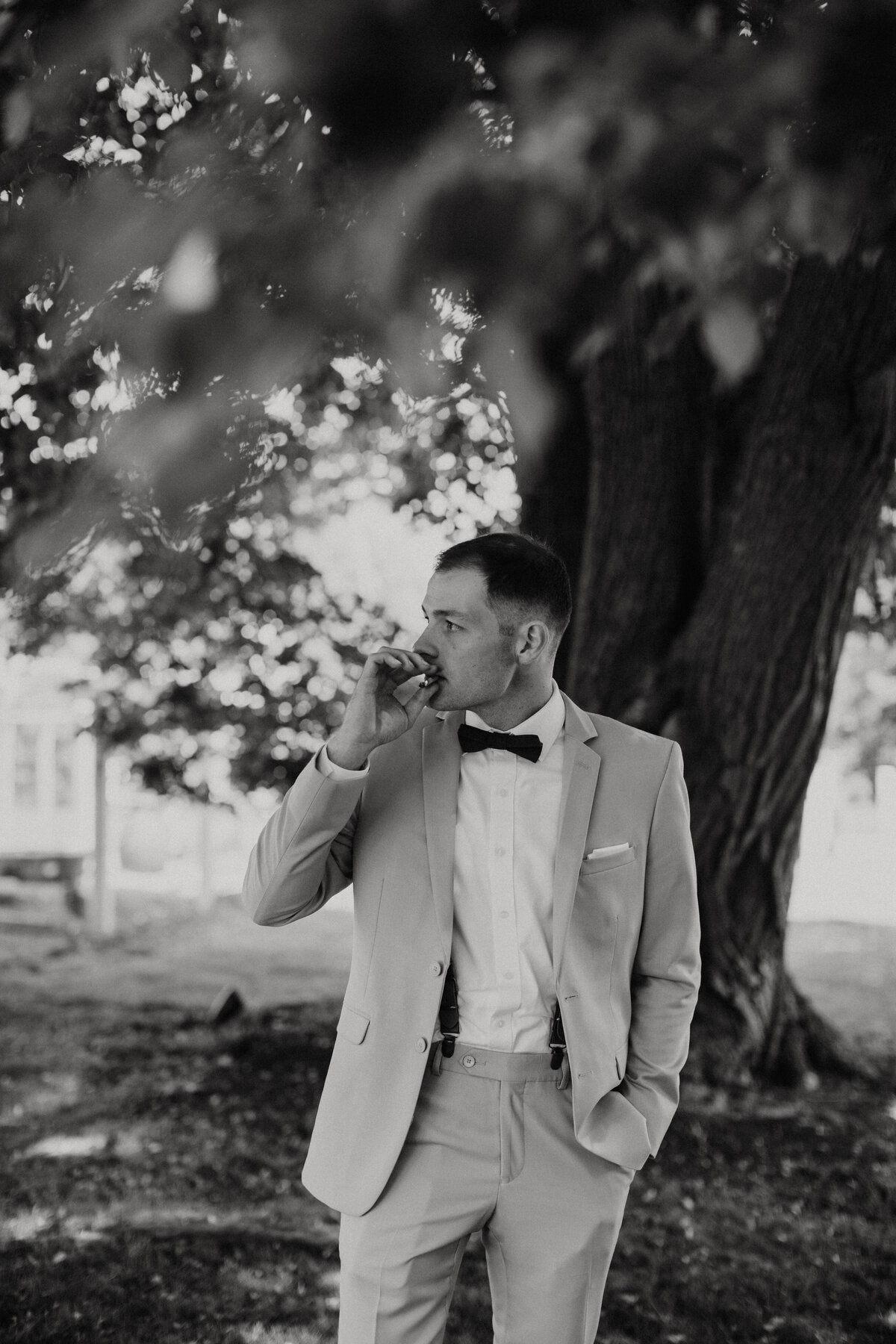 black and white image groom posing