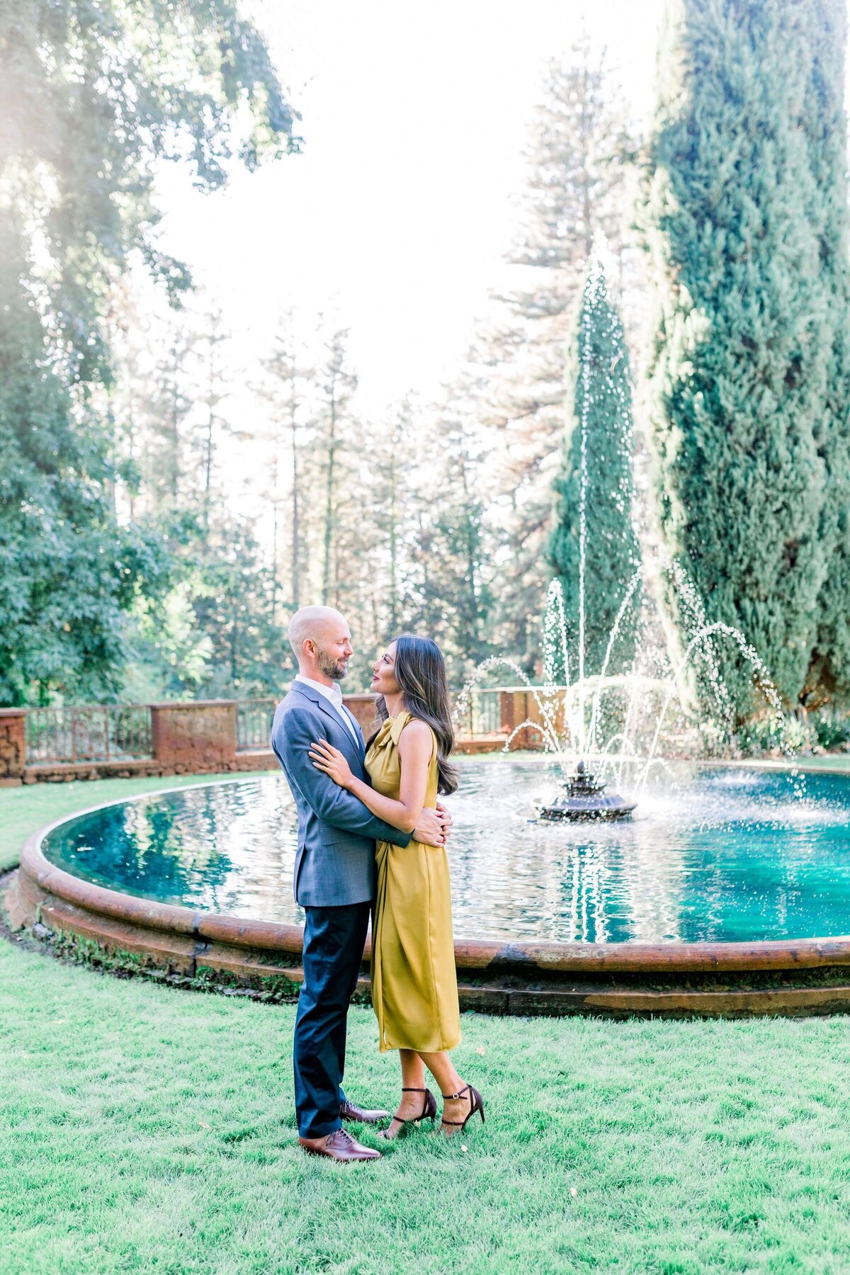 Couple standing in front of a fountain