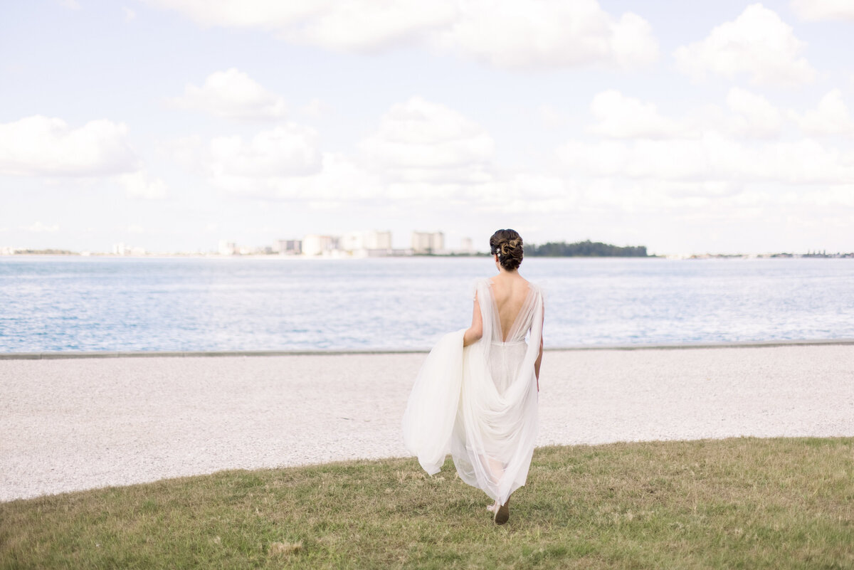 Bride walking to the Sarasota Bay before her Sarasota Ritz Carlton Wedding