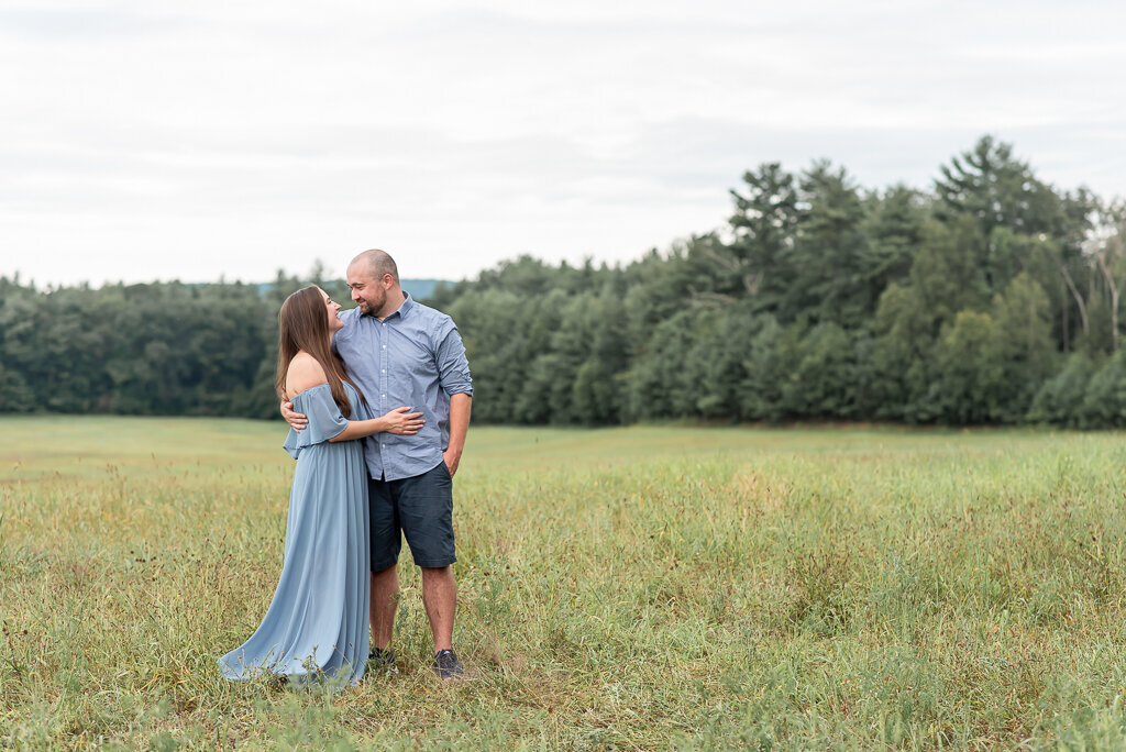 Parents looking at one another in field for CT family pictures |Sharon Leger Photography, Canton, Connecticut | CT Newborn and Family Photographer