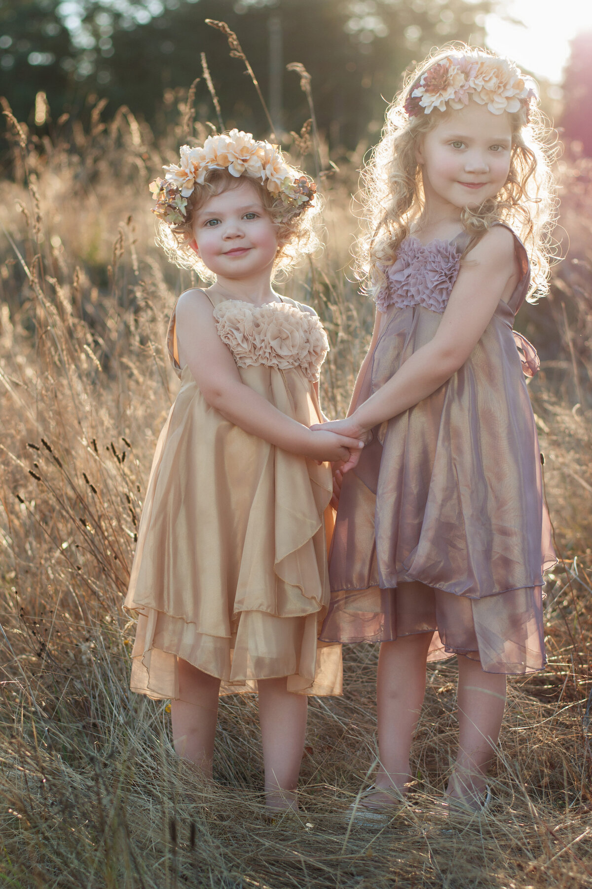 Girls with flower crowns in field