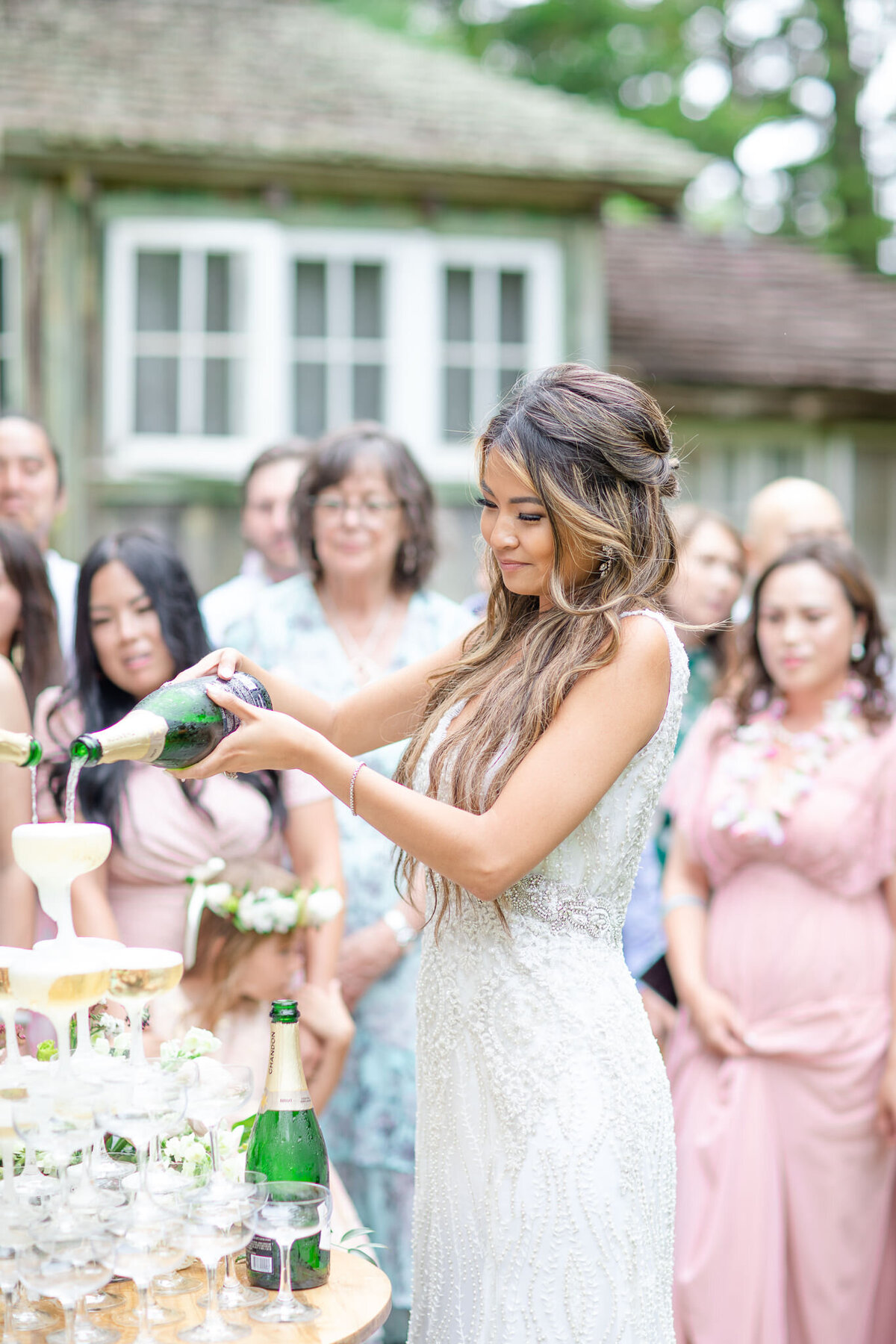 Bride pouring champagne tower