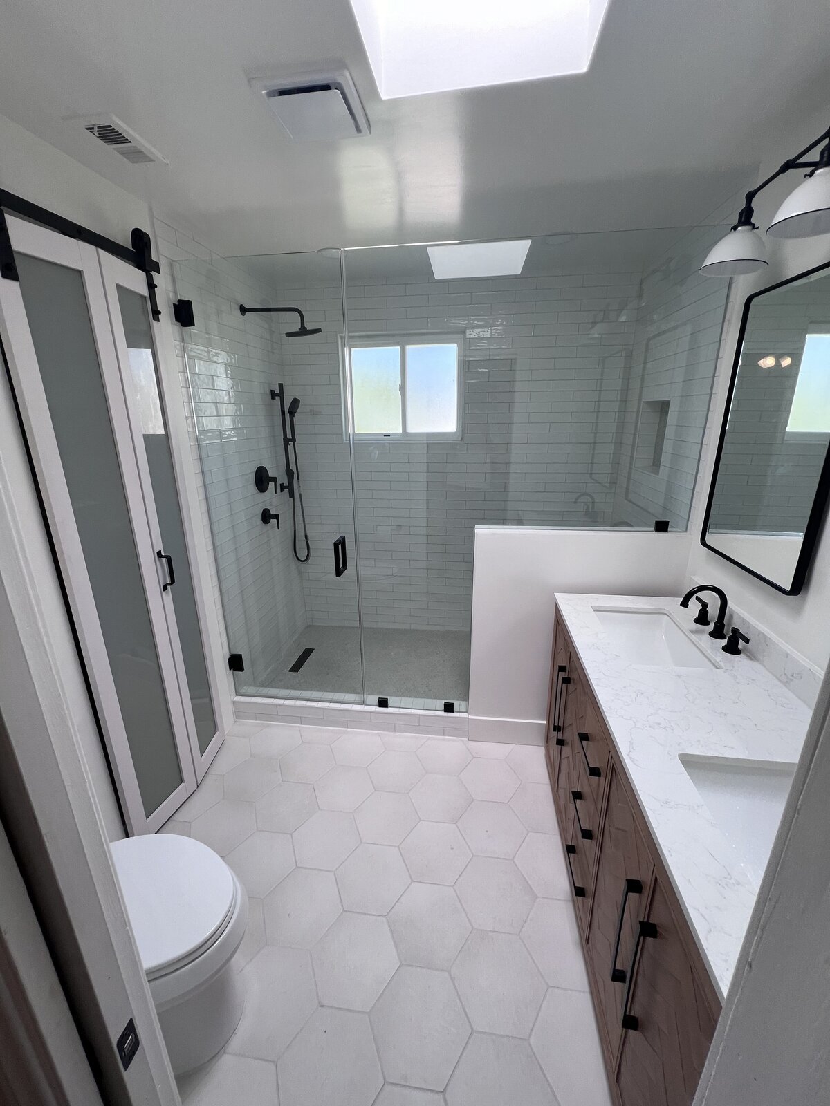 white-bathroom-hex-tile-shower-black-fixtures-aw-development